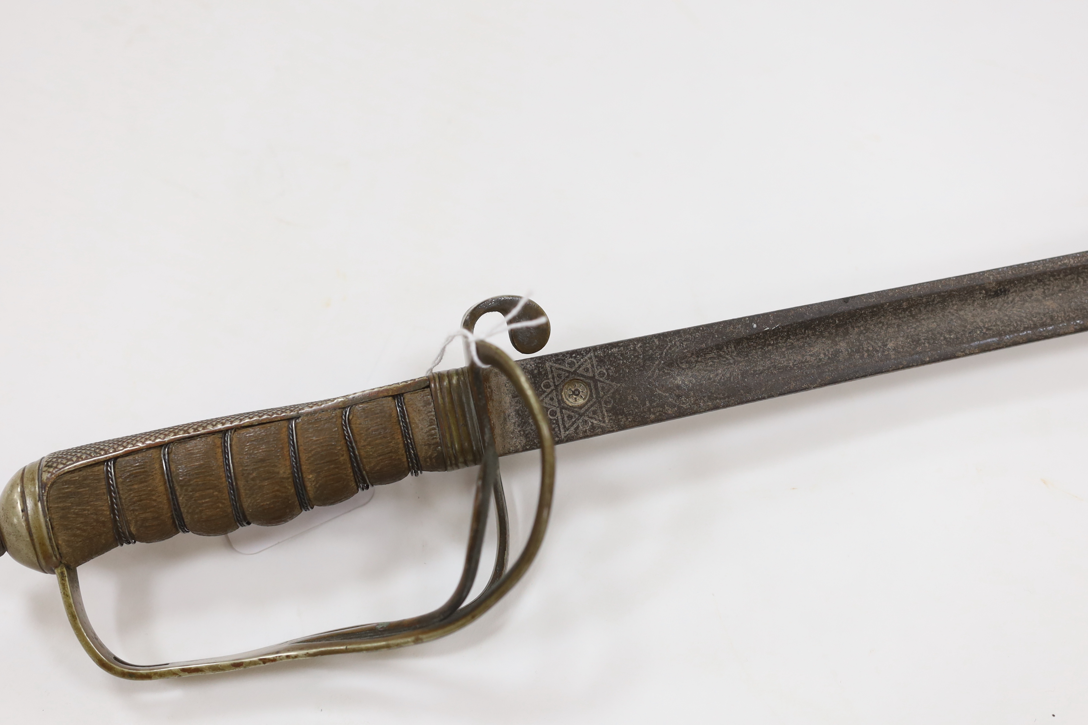 A World War I artillery officer’s sword with nickel guard, blade 82cm